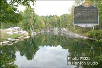 Dorset, VT - Marble Quarry - Water and Reflection with Historic Sign